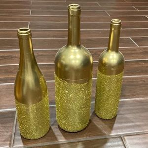 Handpainted and glittered wine bottles